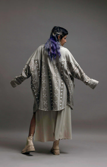 women wearing mud cloth print long coat in grey