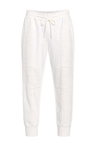 White jogger sweatpants with a drawstring waist, ribbed ankle cuffs, and seam panel details on the legs, shown against a plain white background.