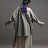 women wearing mud cloth print long coat in grey