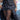 Black leather single-pocket belt with stud details and flap pocket, worn over a Runic Chinatsu Ruffle Skirt