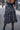 Black Runic Chinatsu Ruffle Skirt with tiered ruffles, back view