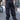 Unisex Combat runic Pants in black with tonal Runic print and buckle straps, back view